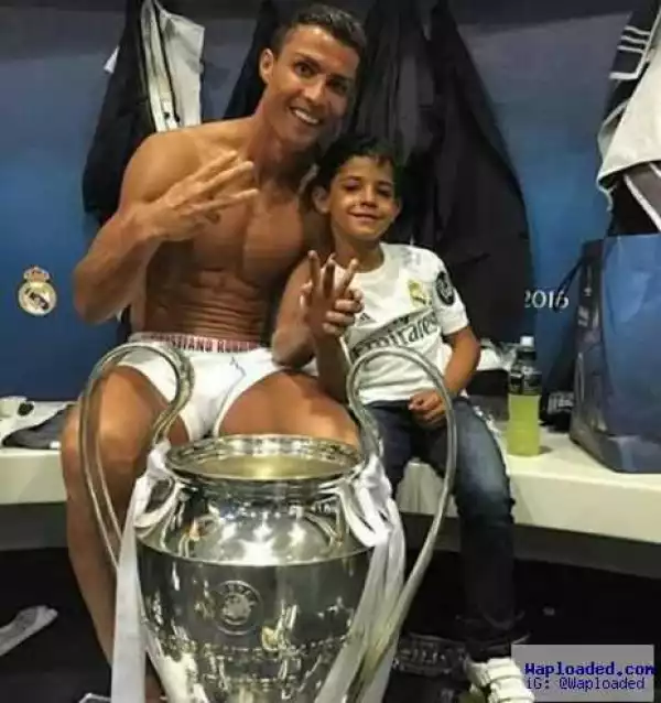 Cristiano Ronaldo and his son pictured with the Champions League Trophy